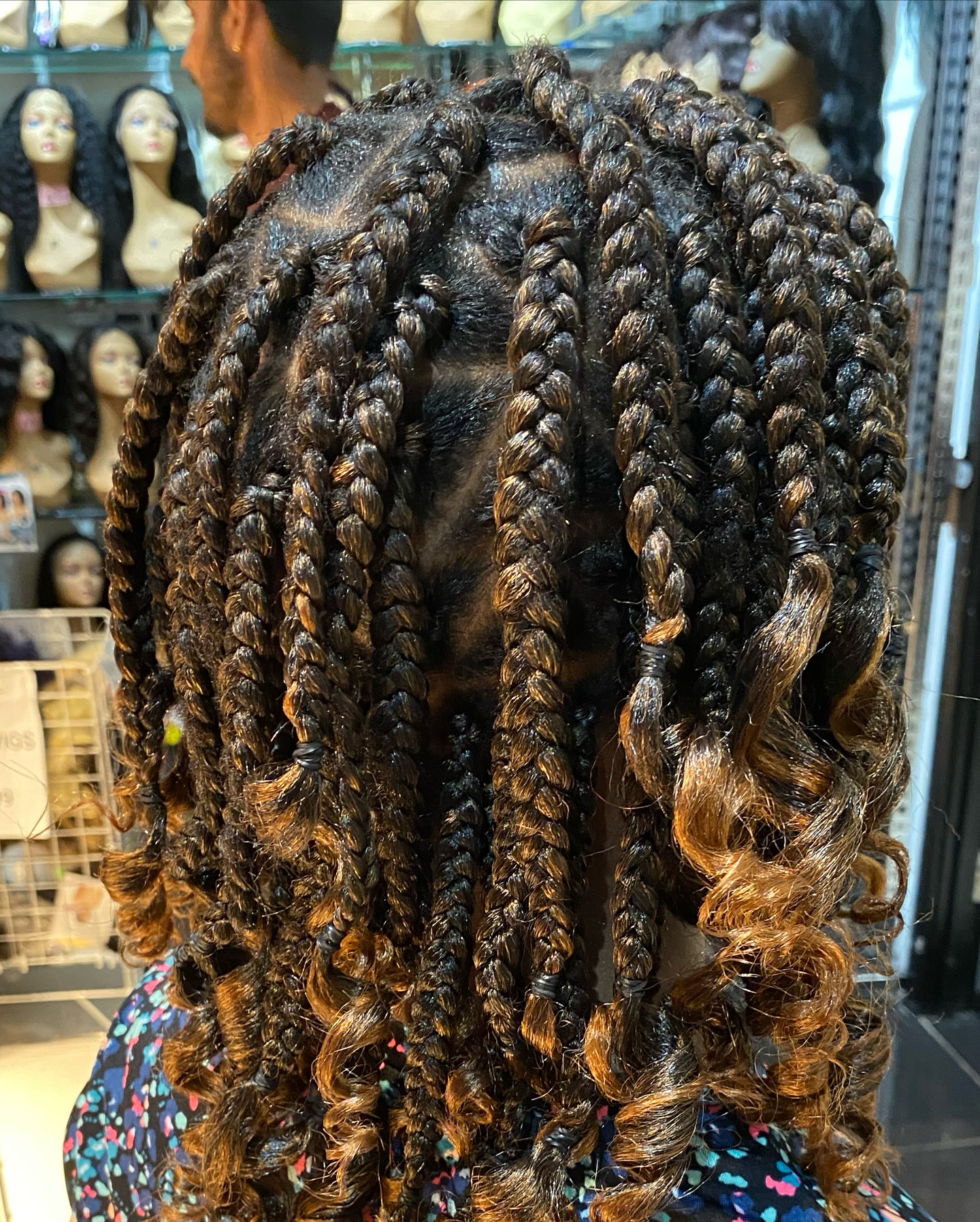 Box braids with honey brown highlights and curly ends by Hair by Sham, Leicester